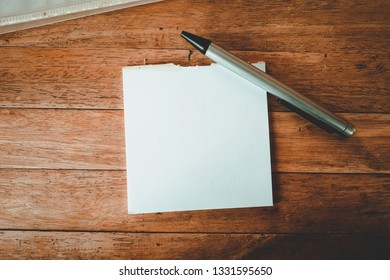 Blank Whitepaper And Pen Set On Wood Table Background