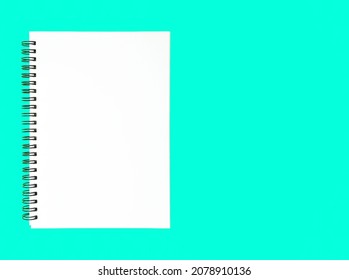 Blank Wire Bound Notebook On A Blue Background