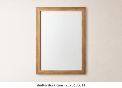 Blank wooden frame, beige wall. flay lay design. Minimal wooden frame. Simple wooden frame. Natural wooden frame.