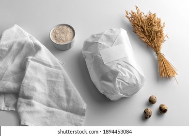 Blank Wrapped Paper Bread With Wheat And Eggs, Bakery Branding Mockup, Empty Space To Display Your Logo Or Design.