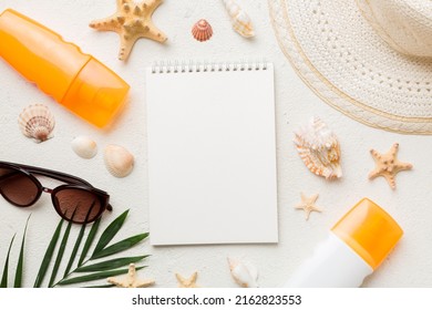 Blank writing book with summer beach accessories on background, copy space. Flat lay with copy space. - Powered by Shutterstock