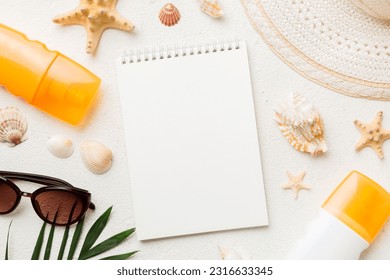 Blank writing book with summer beach accessories on background, copy space. Flat lay with copy space. - Powered by Shutterstock