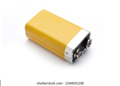 A blank yellow 9v battery isolated on white background - Shutterstock ID 1244031238