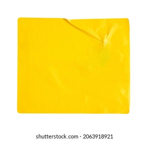 Blank yellow paper sticker label isolated on white background