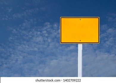 Blank Yellow Road Sign Or Empty Traffic Signs  On Blue Sky Background