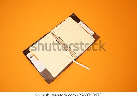 Blanked binder papper with orange background
