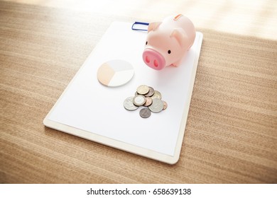 Blank(empty) Clip Board With Pig Coin Bank, Coin, Post It On The Wood Desk.