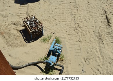 Blankenberge, West-Flanders Belgium - July 10, 2022: Pumping Sea Water Out Of Surrounding Wall Construction Site