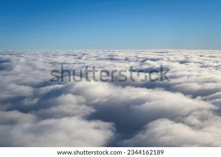 Blanket of clouds and blue sky