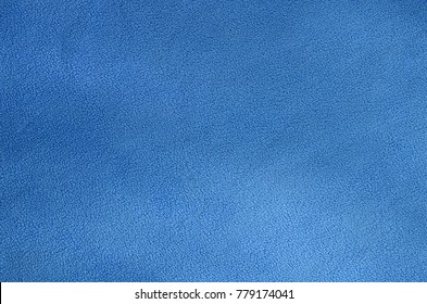 The Blanket Of Furry Blue Fleece Fabric. A Background Texture Of Light Blue Soft Plush Fleece Material