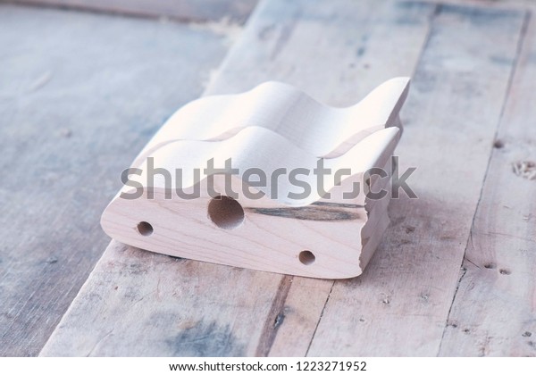 Blanks of wood\
for the manufacture of toy\
cars.