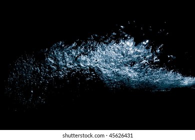 blast of air bubbles in water - high pressure closeup on black