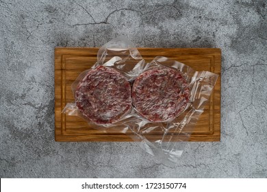 Blast chilled beef patties in a vacuum packing, ready-to-cook meat patties - Powered by Shutterstock