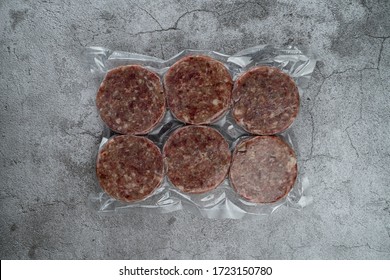 Blast chilled beef patties in a vacuum packing, ready-to-cook meat patties - Powered by Shutterstock