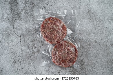 Blast chilled beef patties in a vacuum packing, ready-to-cook meat patties - Powered by Shutterstock