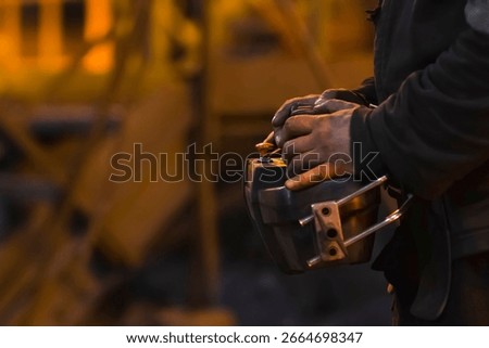 Blast furnace operator at the control panel.