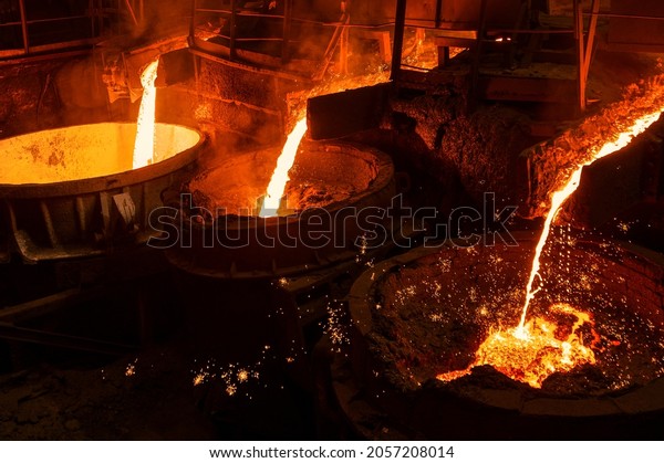 Blast furnace slag and pig iron tapping.\
Molten metal and slag are poured into a\
ladle.