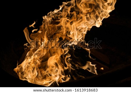 Blazing flames of a fire with black background