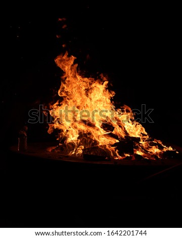 Blazing flames surrounded by darkness.