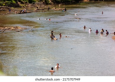 With Blazing Hot Temperatures And Low Water Levels Groups Of People Go Swimming In The Wolf River To Escape The Heat Wave In Memphis, Tennessee. On July 4th, 2022.