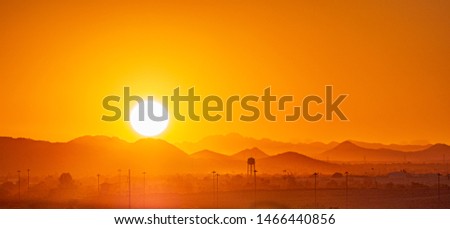 A blazing sun bakes the desert in northern Phoenix, AZ at sunset.