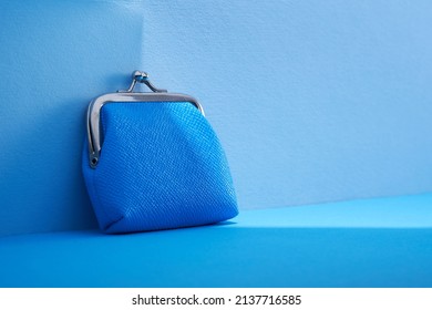 Ble Coin Purse Against Blue Background