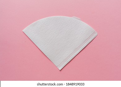 Bleached paper coffee filter isolated on a colored pink background. Alternative brewing pour over coffee. Minimalistic abstract background - Shutterstock ID 1848919033