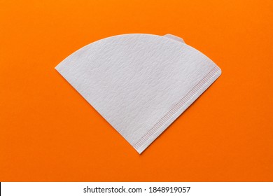 Bleached paper coffee filter isolated on a colored orange background. Alternative brewing pour over coffee. Minimalistic abstract background - Shutterstock ID 1848919057