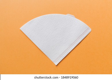 Bleached paper coffee filter isolated on a colored beige background. Alternative brewing pour over coffee. Minimalistic abstract background - Shutterstock ID 1848919060