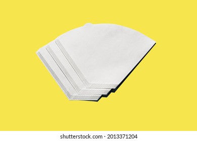 Bleached paper coffee filter isolated on yellow background. Alternative brewing pour over v60 concept. Minimalistic abstract background for store, shop, retail. mock up, top view, place for text - Shutterstock ID 2013371204