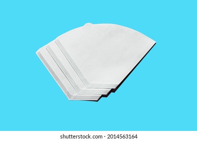 Bleached paper coffee filter isolated on light blue background. Alternative brewing pour over v60 concept. Minimalistic abstract background for store, shop, retail. mock up, top view, place for text - Shutterstock ID 2014563164