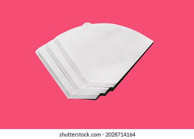 Bleached paper coffee filter isolated on pink background. Alternative brewing pour over v60 concept. Minimalistic abstract background for store, shop, retail. mock up, top view, place for text - Shutterstock ID 2028714164