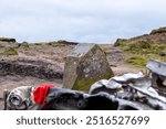 Bleaklow crash site, Peak District. Features the wreckage of a USAF B-29 Superfortress from 1948. A poignant memorial in a rugged, windswept landscape, popular with hikers and history enthusiasts.