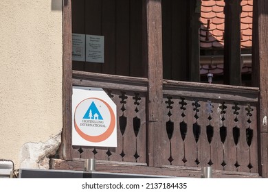 BLED, SLOVENIA - JUNE 13, 2021: Hostelling International logo on their local hostel in Bled, Slovenia. Hostelling international is a federation of accomodation and hostels spread worldwide.