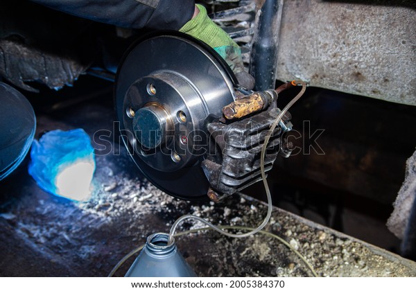 bleeding the brake hydraulic system, hose\
from the caliper, changing the brake\
fluid.