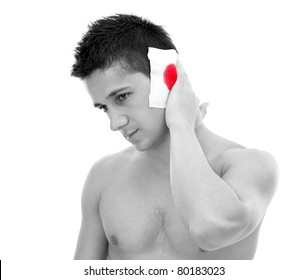 A Bleeding Wound On The Left Ear Of A Young Man, Isolated On White Background