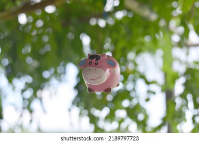 Blended Image Of A Cow Hanging From A Tree