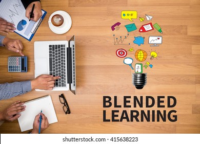 BLENDED LEARNING Business team hands at work with financial reports and a laptop - Shutterstock ID 415638223