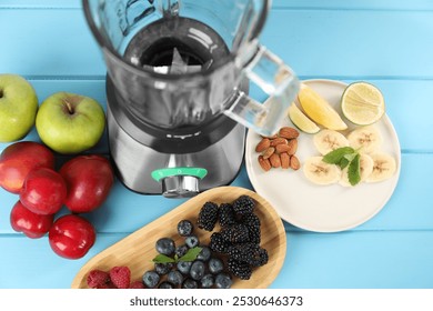 Blender and fresh ingredients on light blue wooden table, above view - Powered by Shutterstock