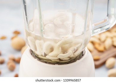 Blender With Soaked Cashews For Making Nut Milk. Dairy Free, No Lactose Vegan Milk.