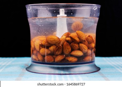 Blender With Water And Soaked Almonds For Making Nut Milk. Dairy Free, No Lactose Vegan Milk.