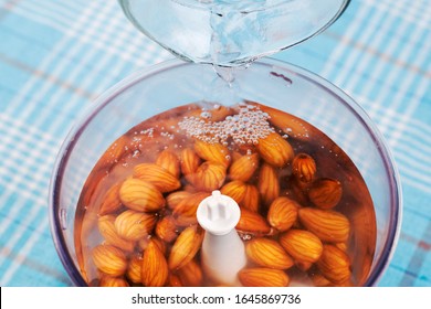 Blender With Water And Soaked Almonds For Making Nut Milk. Dairy Free, No Lactose Vegan Milk.