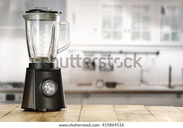 blender and wooden table in\
kitchen 