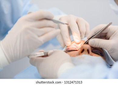 Blepharoplasty, plastic surgery operation for correcting defects, deformities, and disfigurations of the eyelids; and for aesthetically modifying the eye region of the face. in medical clinic - Shutterstock ID 1312471313
