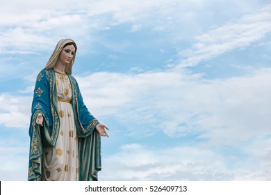 The Blessed Virgin Mary in the blue sky.