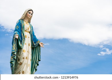 The Blessed Virgin Mary,mother Of Jesus On The Blue Sky, In Front Of The Roman Catholic Diocese, Public Place In Chanthaburi, Thailand.