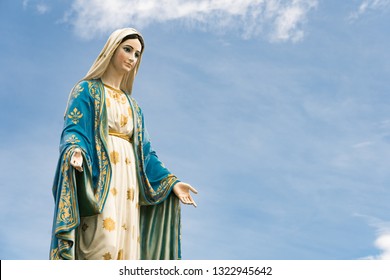 The Blessed Virgin Mary,mother Of Jesus On The Blue Sky, In Front Of The Roman Catholic Diocese, Public Place In Chanthaburi, Thailand.