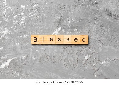 Blessed Word Written On Wood Block. Blessed Text On Table, Concept.