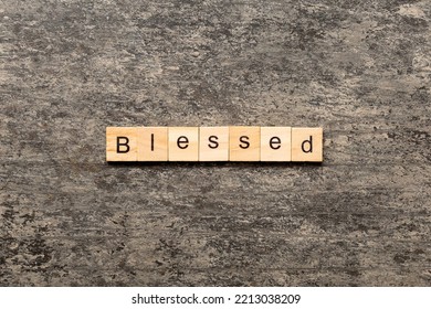 Blessed Word Written On Wood Block. Blessed Text On Table, Concept.