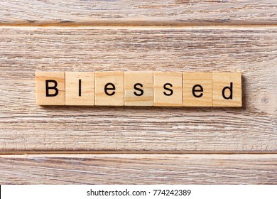 Blessed Word Written On Wood Block. Blessed Text On Table, Concept.